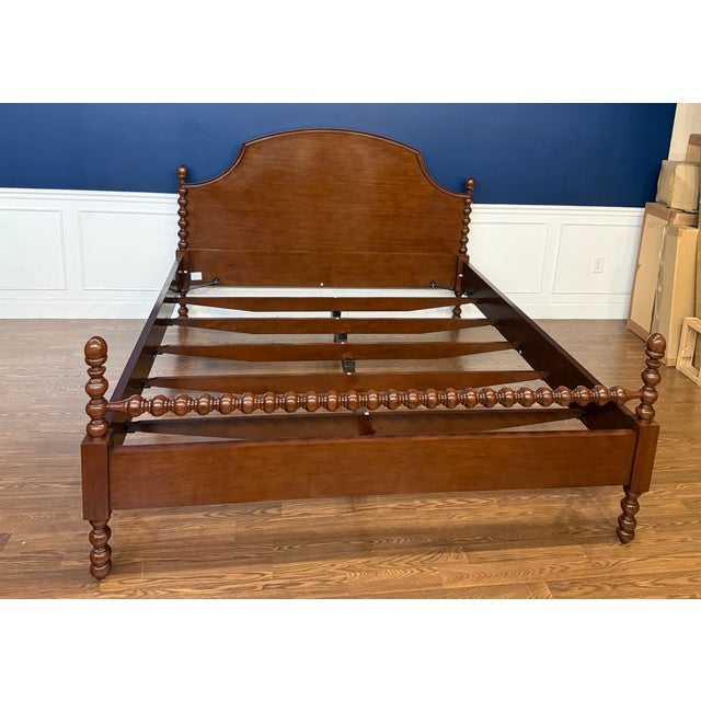 This is a classic King Size Mahogany Spindle Bed by Leighton Hall. It features classically carved spindles on the four...