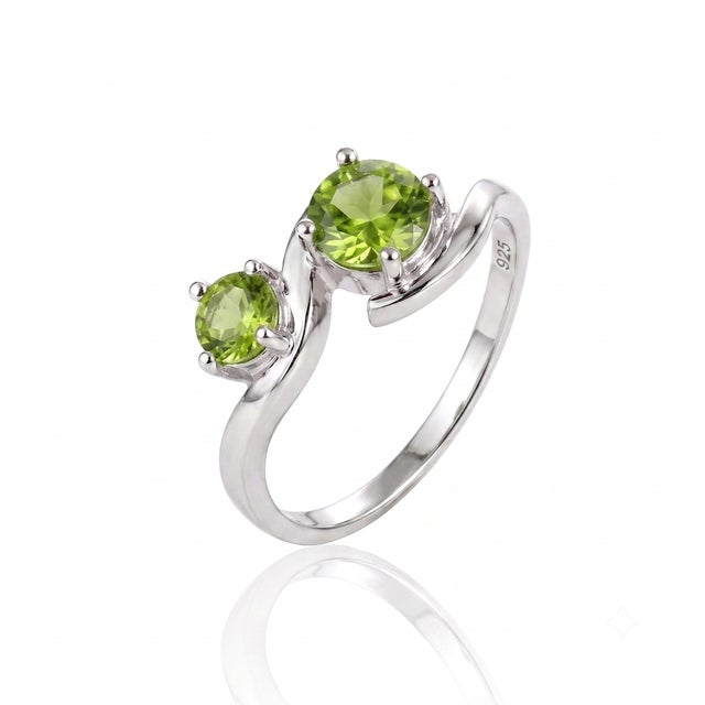 Exuding fresh, natural beauty, this ring's interlocking metal curves frame twin lime-green gemstones for a lively, eye-...