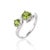 Exuding fresh, natural beauty, this ring's interlocking metal curves frame twin lime-green gemstones for a lively, eye-...