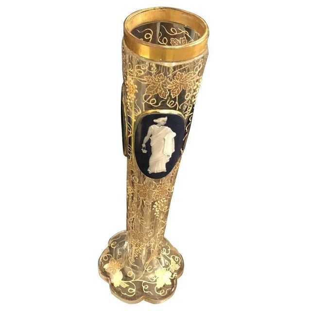 This cut and enameled vase is a stunning piece that is certain to capture your attention. The enameled vase is decorated...
