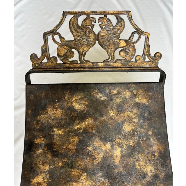 Introducing the Early 1900's Oscar Bach Style Griffin Metal X Base Stool, a magnificent piece that captures the essence of...