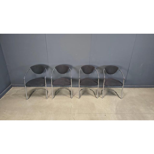 Tubular chrome and black fabric italian dining chairs by Effezeta. Beautifully shaped frames. 1970s, Italy Good overall...