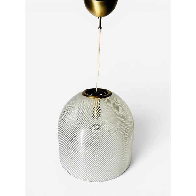 Large Venini Murano glass pendant lamp “Tessuto”. Swirling line design, this stunning glass technique was originally...
