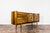 The credenza in walnut veneer was manufactured by Bytomskie Fabryki Mebli in the 1960s. It is part of the “Syrius” type...