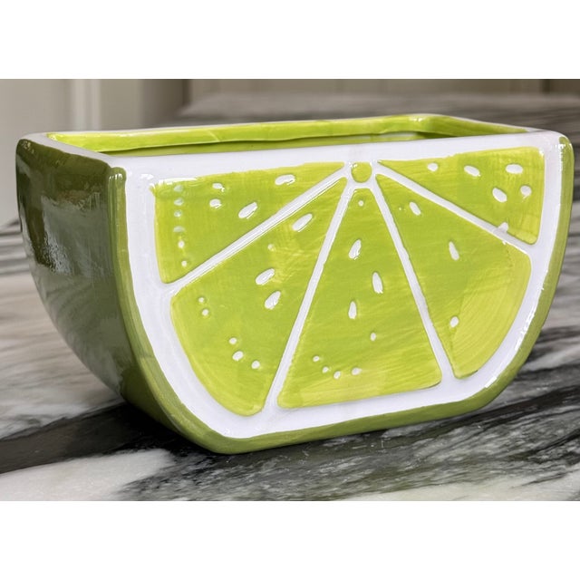 Bring some summer color to your next occasion with this vintage lime motif vessel. Displays as functional art, useful as a...