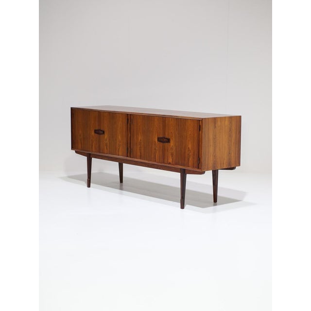 This rare danish sideboard was produced by nc møbler odense in the 1960s. Often attributed to niels clausen, with some...