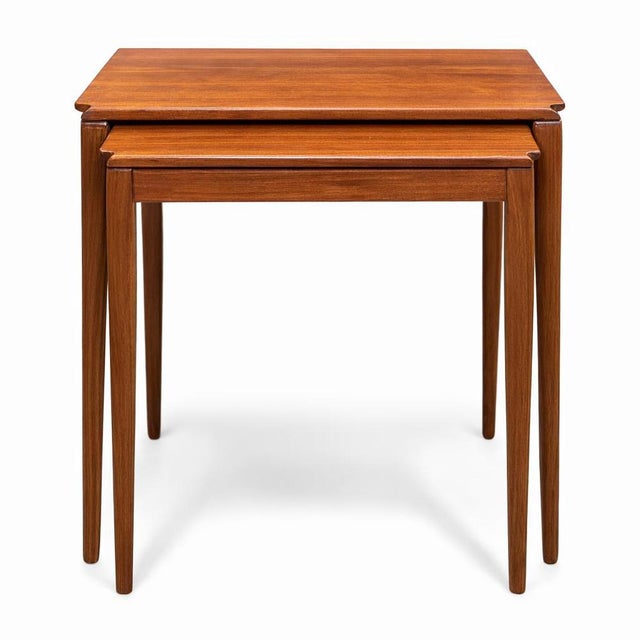 A beautifully designed mid-century teak nest of three tables by Richard Hornby, showcasing the refined craftsmanship and...