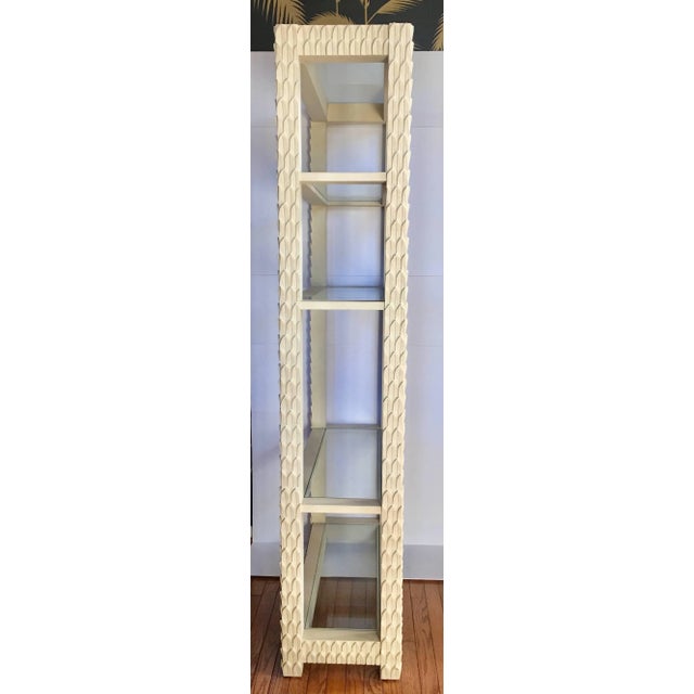 Stunning midcentury hand-carved palm frond motif étagère bookcase in the style of Serge Roche. Heavy solid wood frame...