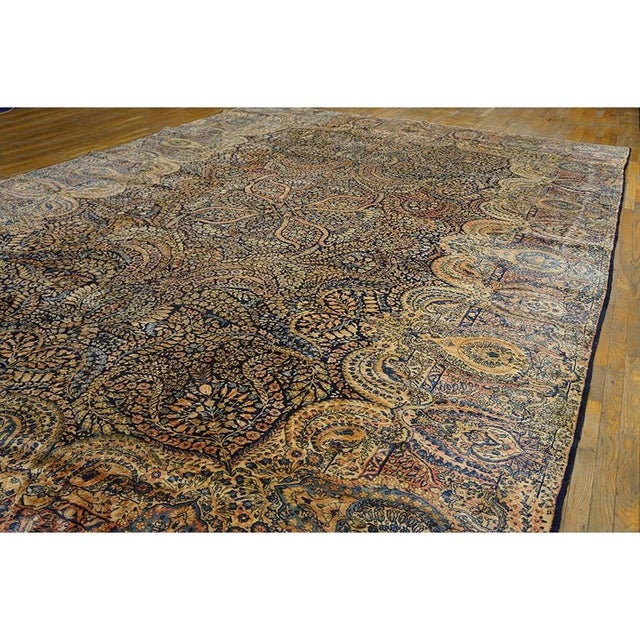 "This grand 1930 Antique Kirman Formal carpet represents a beautiful textile artistry. Measuring an impressive 11' 9" x...