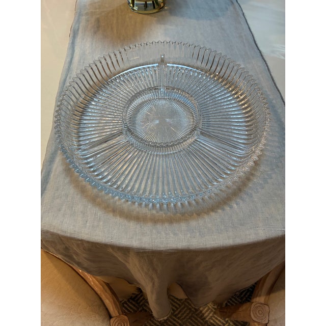 Heavy ribbed glass design that catches and reflects light, contains three separate sections.