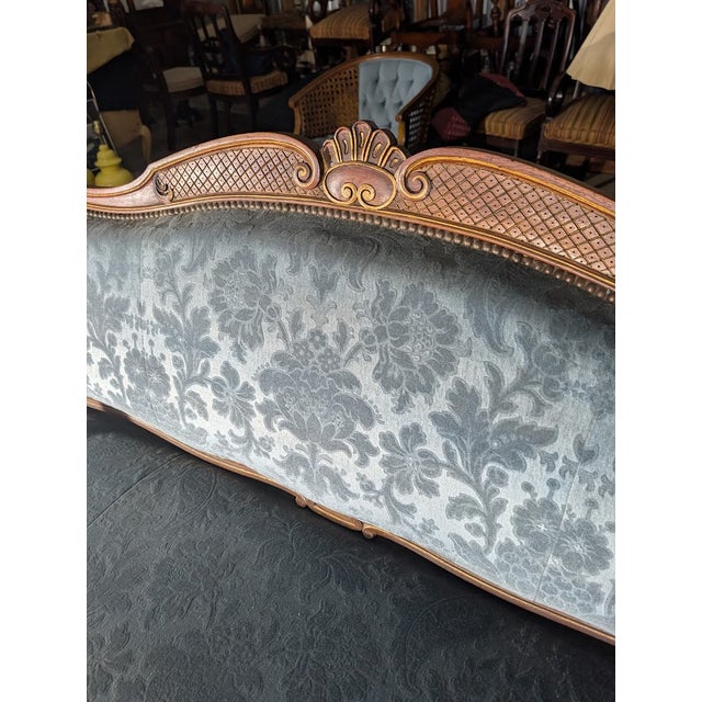 Elevate your space with this graceful vintage French Louis XV style settee, a perfect blend of rococo elegance and...