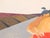 Modern pastel drawing of a pair of sumo wrestlers in the middle of a match wearing red mawashi set against a grey floor....