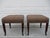 A pair of large Kindel bunching stools with a tuape fabric and rope style piping. The stools sit atop long dark-cherry...