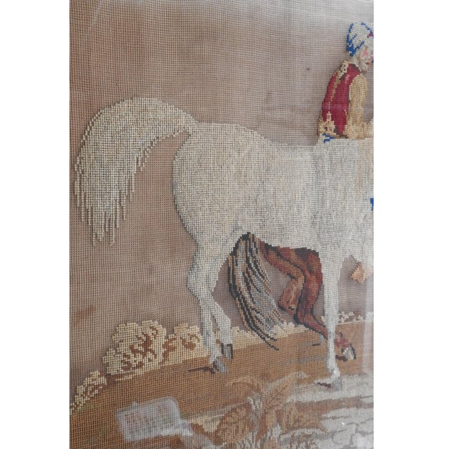 Large antique late 19th century needlepoint tapestry of Arabian horses and rider. Background of tapestry has not been...