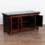 The red lacquered polished finish with contrasting black top on this small Chinese sideboard provides a modern look...