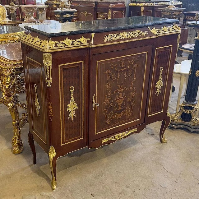 Magnificent french copper commode. The design on the door is sublime, all the wooden details make the piece stand out...