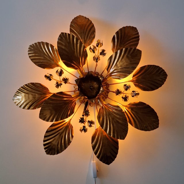 An elegant florentine-style wall or ceiling light by hans kögl from the 1970s. this florentine-style wall light is made of...