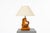 This unique free-form table lamp was handcrafted in France during the 1950s. It features a sculptural base carved from a...