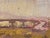 This gouache artwork captures a serene landscape beneath an overpass, where muted earth tones blend harmoniously to evoke...