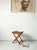 This folding stool, crafted from solid pine, is a minimalist design from the 1950s and was made in Belgium. It is in...