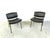 Set of 2 mid century modern 'conseil' chairs designed by Pierre Guariche for Meurop. The chairs have a black lacquered...