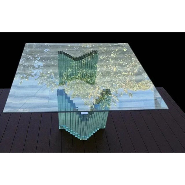 Italian design glass coffee table, 1980s The base consists of pyramid-shaped legs assembled with glass plates, with a...