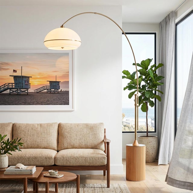 Featuring a dramatic blend of suspension and natural materials, the Tambo 92" Arc Lamp is a Mid-Century Modern masterpiece...