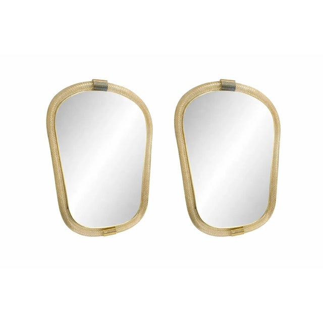 Pair of Italian Murano Glass Wall Mirrors in Gold Leaf “Torciglione” Venetian Design Scenographic wall mirror in brass...