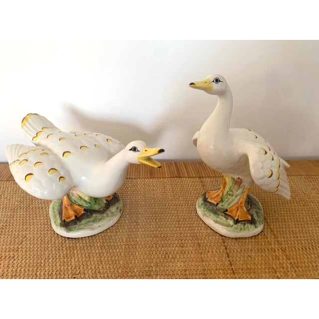 Sweet pair of Italian mid century ceramic geese. Nice large size on a bookshelf. Two different poses. In excellent vintage...