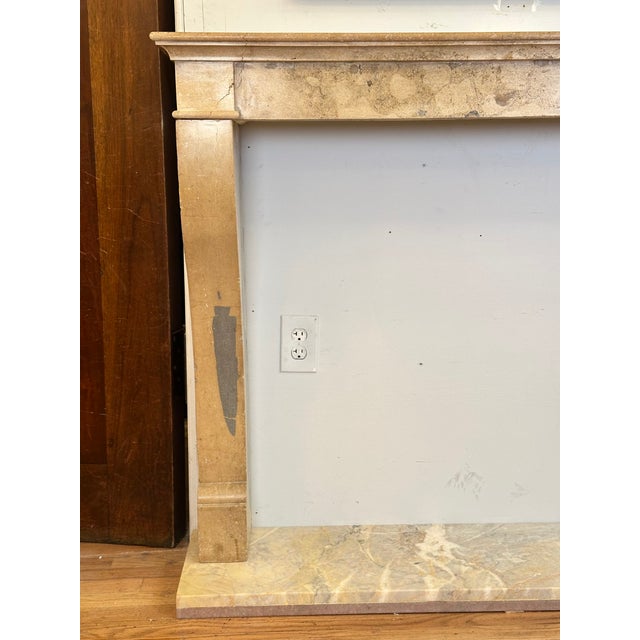 This unique tan and gray petite marble mantel was reclaimed by Olde Good Things from a private Manhattan residence on East...