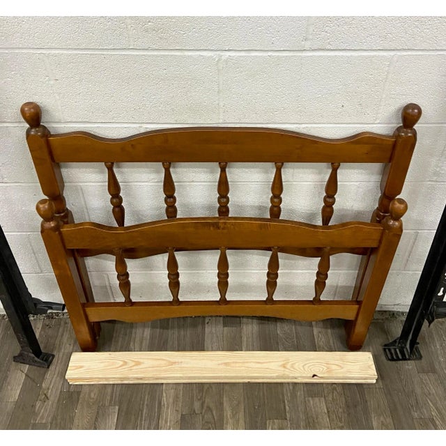 This is a stunning vintage twin sized wood low poster bed with acorn finials and believed to be maple wood. Features...