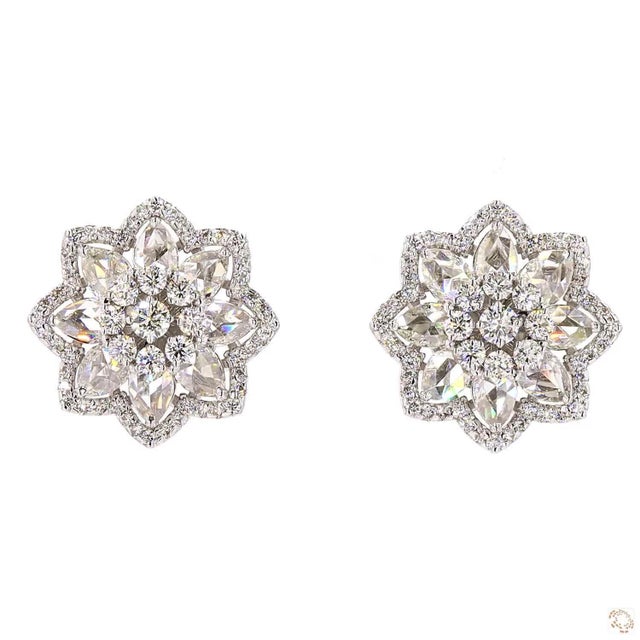 This pair of estate earrings from our contemporary estate collection centers on a 1.33-carat diamond in a round brilliant...