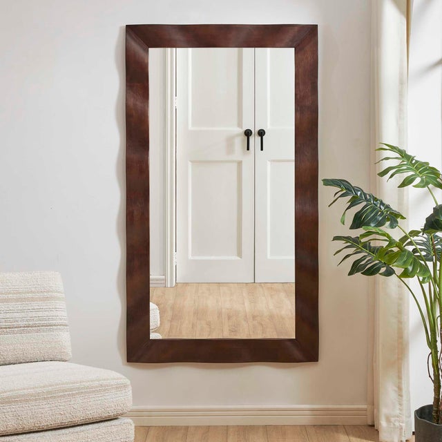 With Its Rich Dark Walnut Finish And Distinctive Wavy Solid Wood Frame, This Mirror Offers A Sophisticated Yet Playful...