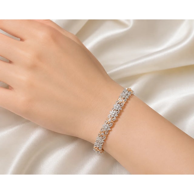 Elegant 18K pink and white 2tone gold flex bracelet featuring brilliant round diamonds totaling 1.2 carats. Estate piece...