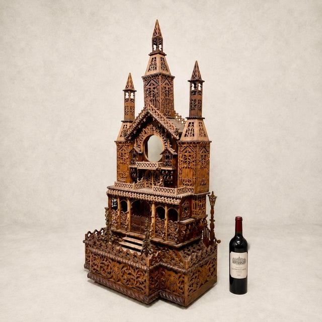 A large and highly decorative architectural clock case in hand-carved wood, likely late 19th to early 20th century. The...