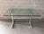 Vintage Mid Century Modern Dining Room Table in the Milo Baughman Style. Circa 1970s. Features a polished aluminum frame...