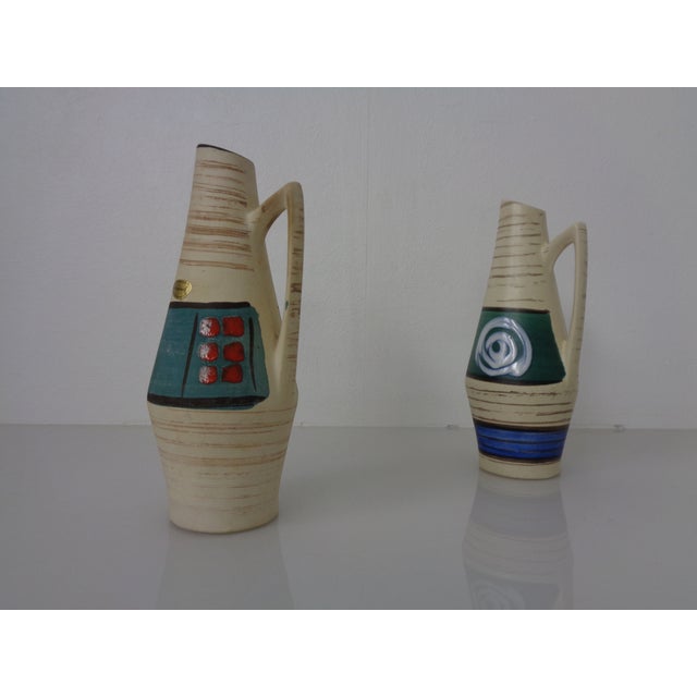 Two ceramic Henkel vases by Heinz Siery for Scheurich. Marked on the undersides. This piece has an attribution mark, I am...