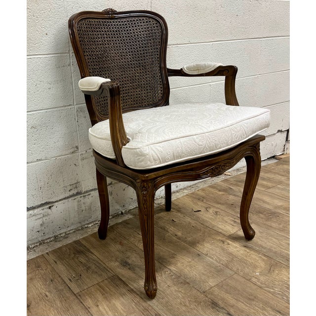 This is a gorgeous vintage (possibly antique) Louis XV style caned fauteuil or arm chair. It features beautiful caning and...