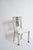 Neoclassical pineapple chairs, 1960s. Pair of chairs in grey and black lacquered wood, the openwork back decorated with a...