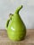 Presenting an authentic vintage Italian glazed ceramic olive oil pitcher, a charming and functional piece that brings...