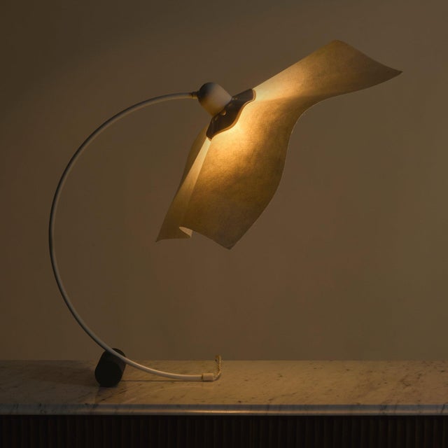 An Italian ‘Area Curvea’ table lamp by Mario Bellini from the 1970s. Defined by its sweeping, continuous arc, the design...