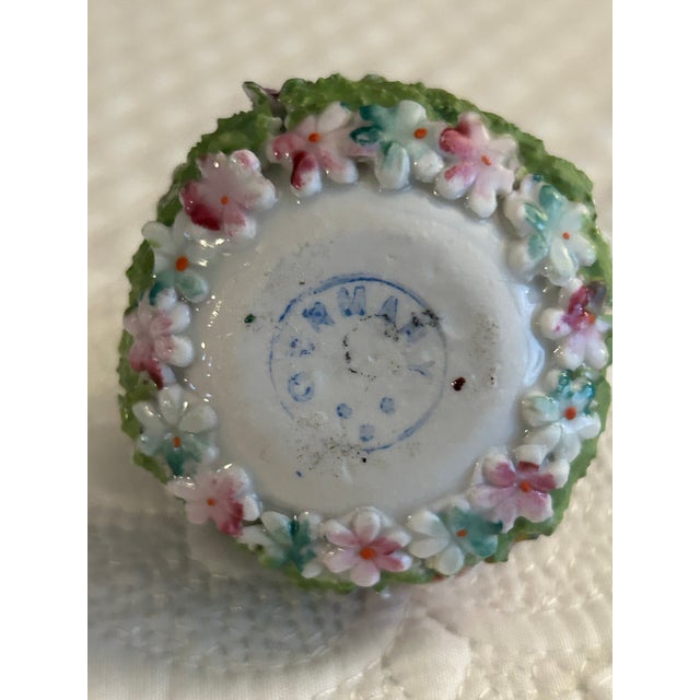 Small German ceramic basket with applied flowers Stunning colors of blue, green and pink 2 1/2” h x 2” d Stamped made in...