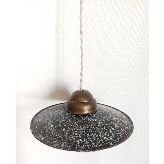 Pair of "industrial pancake" pendant lights made of anthracite gray enameled sheet metal with light gray speckles....