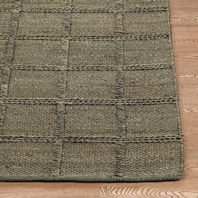 Woven jute rug in warm inviting olive green. Square lattice pattern adds subtle texture and dimension. Available in...