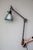 Beautiful Midgard Type 114 two-arm wall lamp with a parabolic metal shade. The conical jointed head on the shade is...