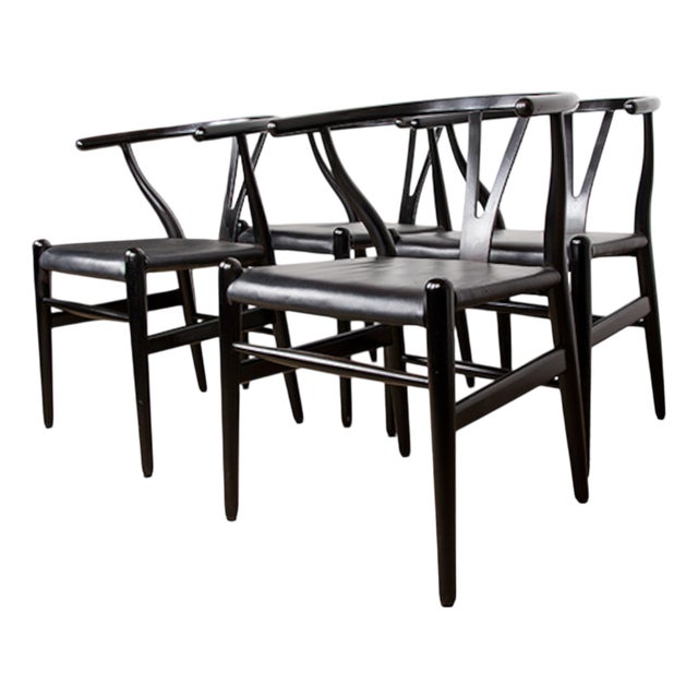 Danish Model CH 24 Wishbone Chairs in Black Lacquered Wood and Leather by Hans Wegner for Carl Hansen, 1960s, Set of 4 For Sale