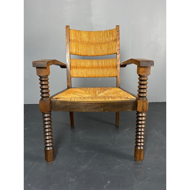 "Brutalist" French oak rush armchair in the manner of Charles Dudouyt, ca 1950s. This chair in in a lovely patinated...