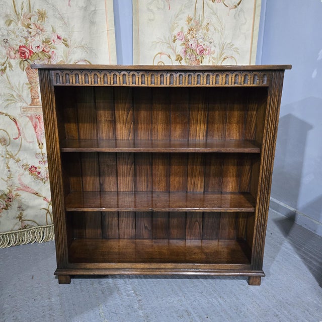Excellent quality solid oak, open adjustable library bookcase, two shelves, in excellent home ready condition having been...