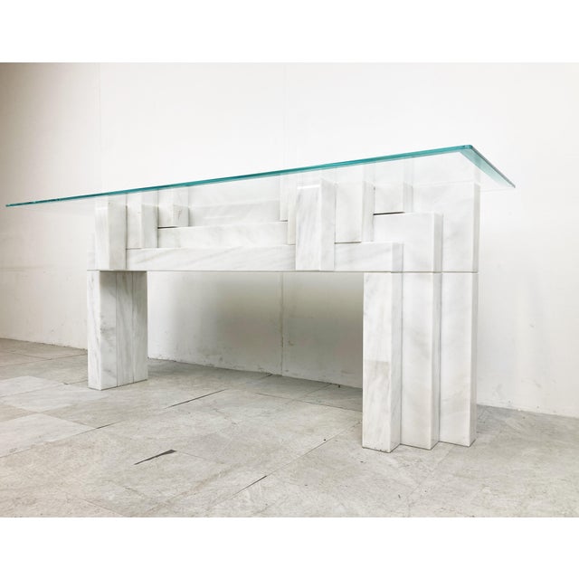 Stunning architectural white marble console table. This solid marble console has a nice architectural stepped design. The...