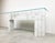 Stunning architectural white marble console table. This solid marble console has a nice architectural stepped design. The...